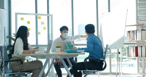 Wallpaper Mural New normal life style in office after coronavirus pandemic, Woman boss walk pass colleague work desk Torontodigital.ca