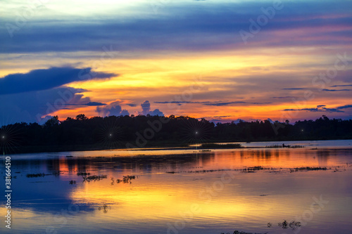 sunset over the river © Thongtu