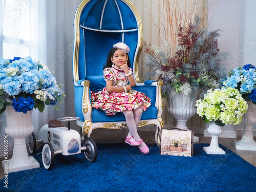 beautiful girl wearing a floral dress in retro style.