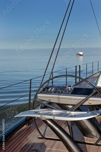 Sailing at the Waddenzee. Super sailing Yacht .Ship building industry. Netherlands. Steeringwheel © A