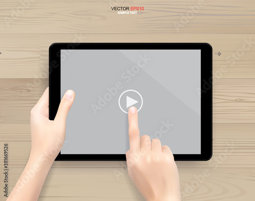 Hand holding and touch screen tablet computer on white wooden background. Vector.