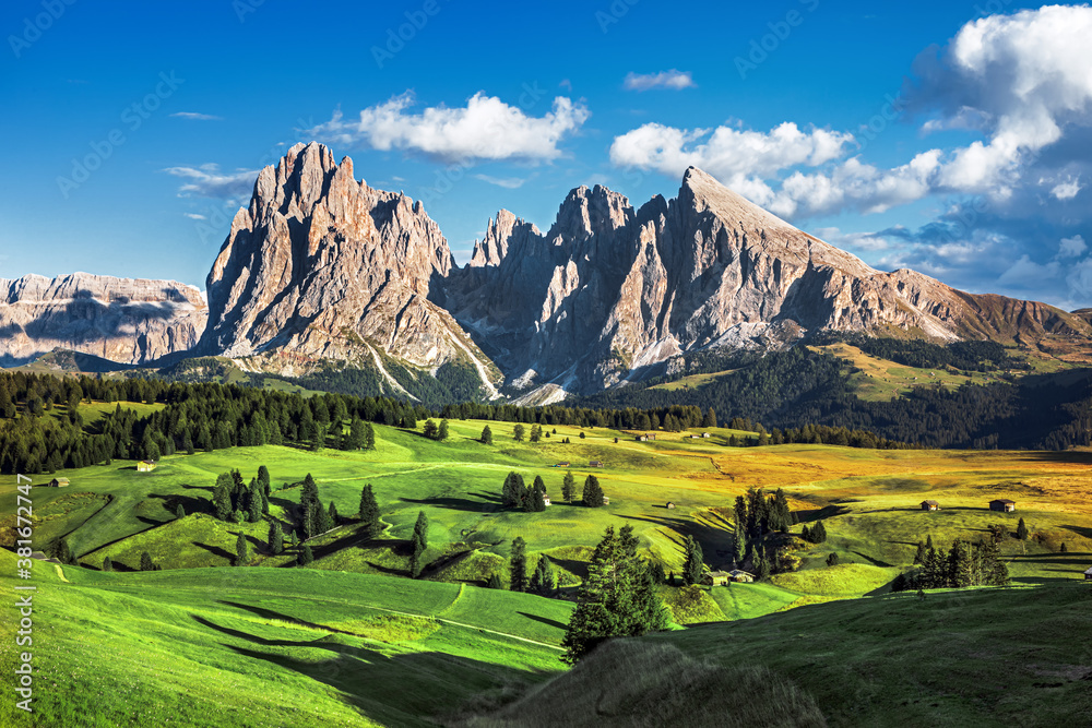 Famous Alpe di Siusi - Seiser Alm with Sassolungo - Langkofel mountain  group in background at sunset. Wooden chalets in Dolomites, Trentino Alto  Adige region, South Tyrol, Italy Stock-Foto | Adobe Stock