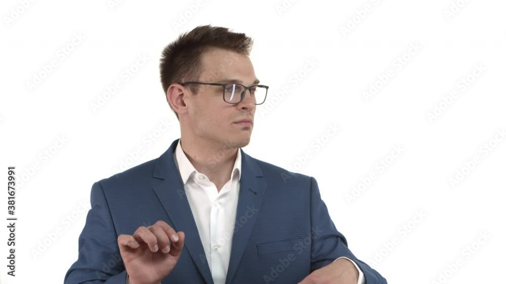 Handsome successful businessman in blue suit and glasses feeling good and confident, dancing from joy and satisfaction, standing over white background Handsome successful businessman in blue suit and glasses feeling good and confident, dancing from joy and satisfaction, standing over white background