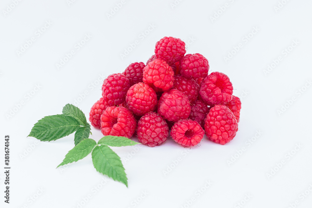 a bunch of raspberries with a green petal on a white background
a bunch of raspberries with a green petal on a white background