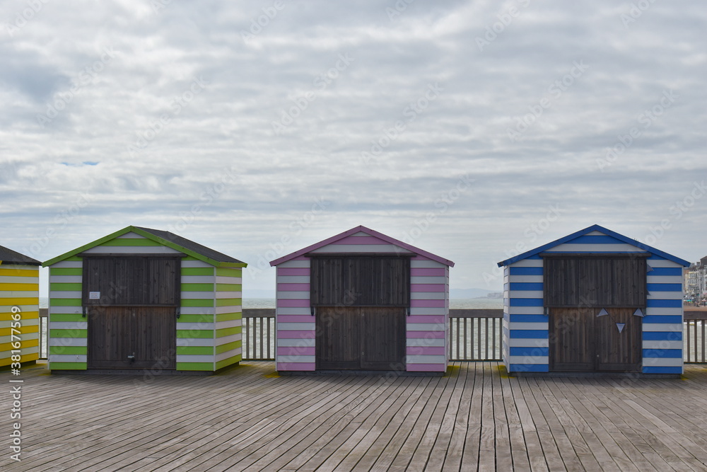 Hastings pier beach huts which are souvenir shops and photo booth. Generally used as shelter from the sun or wind changing into and out of swimming costumes and for safe storing of personal belongings Hastings pier beach huts which are souvenir shops and photo booth. Generally used as shelter from the sun or wind changing into and out of swimming costumes and for safe storing of personal belongings
