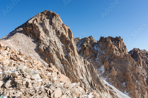Mountain landscape view in Kyrgyzstan. Rocks, snow and stones in mountain valley view.