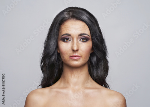 Face of an old woman isolated over grey background