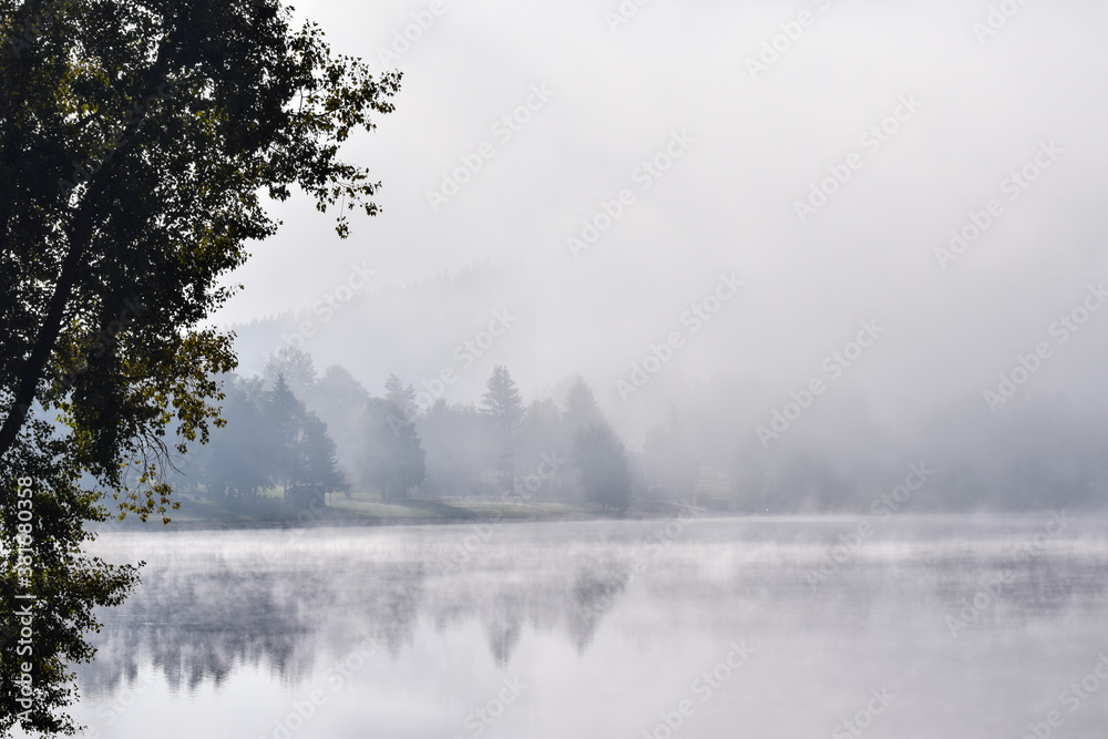 Fog over a lake in the morning in Lipno Nad Vltavou, Czech Republic