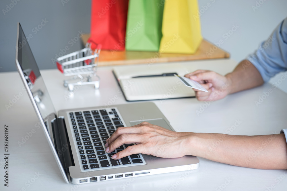 Woman using credit card register security code and payments online shopping and customer service network connection market, using on laptop, Internet Online shopping or internet banking concept Woman using credit card register security code and payments online shopping and customer service network connection market, using on laptop, Internet Online shopping or internet banking concept