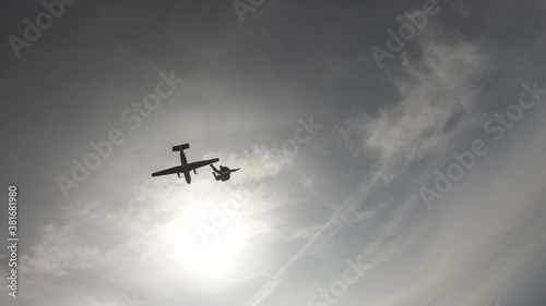 Skydiving. Tandem jump. The start of the flying near the Sun.