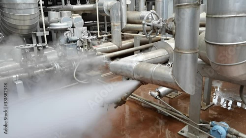 Steam and water leaking from piping of process steam.