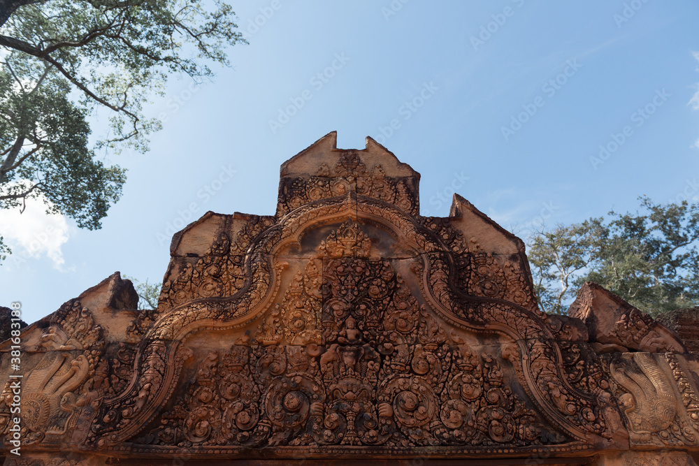 Banteay Srei or Banteay Srey or The Pink Sandstone temple was built largely of red sandstone, decorative wall carvings which still observable, Siem Reap, Cambodia.