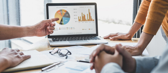 Business team collaboration discussing working analyzing with financial data and marketing growth report graph in team, presentation and brainstorming to strategy planning making profit of company