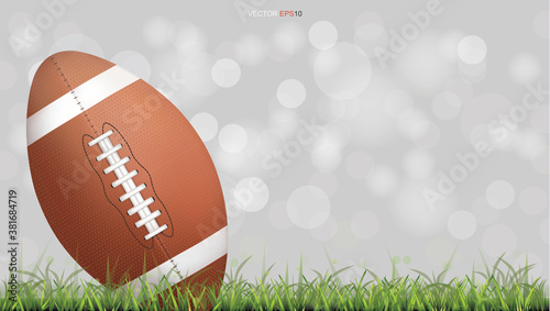 American football ball or rugby football ball on green grass court with light blurred bokeh background. Vector.