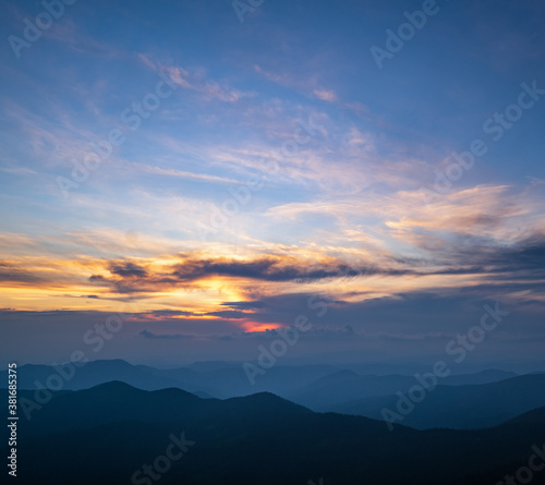 Summer misty evening mountain tops silhouettes. Marmaros, Carpathian, Ukraine.