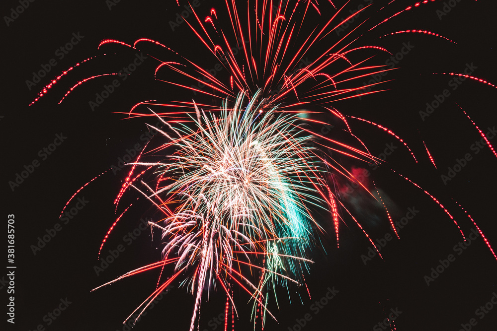 Red green yellow white fireworks in the sky Red green yellow white fireworks in the sky