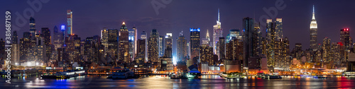 Skyscrapers of New York City, Manhattan West skyline illuminated at night. Elevated panoramic view from across the Hudson River. NYC, USA © Francois Roux