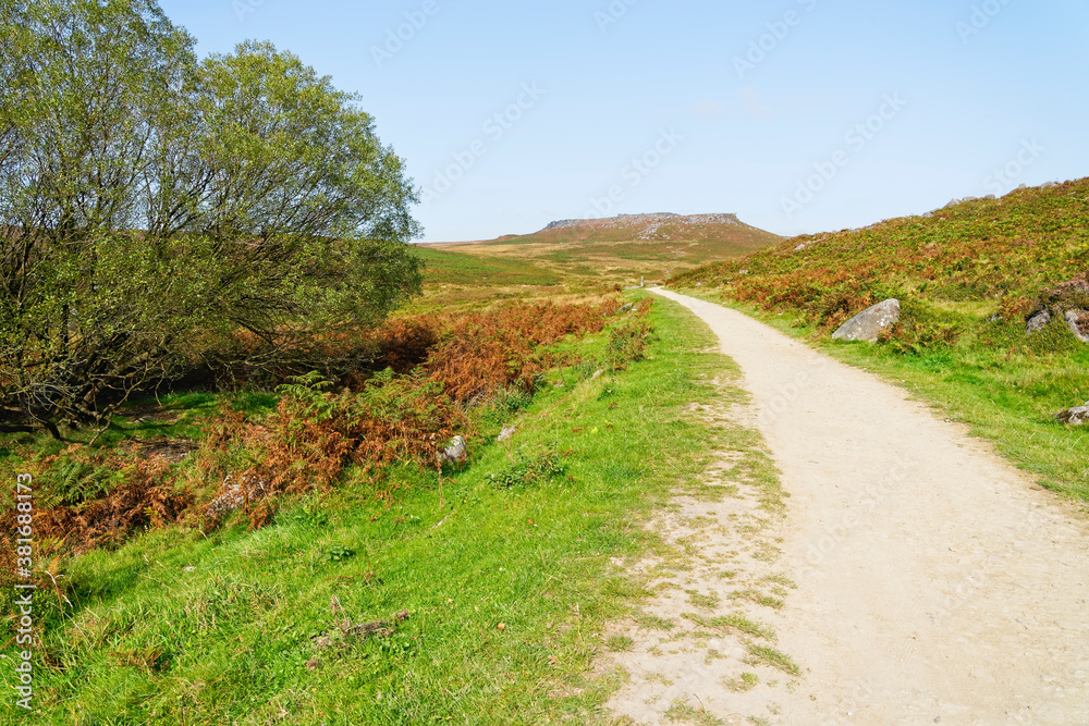 Follow the footpath to a distant, hazy Carl Wark fort on a misty Derbyshire day