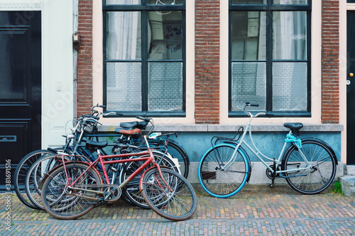 Bicecles which are a very popular transport in Netherlands parked in street near old houses. Utrecht, Netherlands © Dmitry Rukhlenko