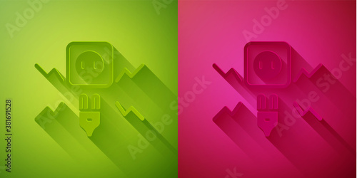 Paper cut Connecting electric plug with electricity spark icon isolated on green and pink background. Paper art style. Vector.
