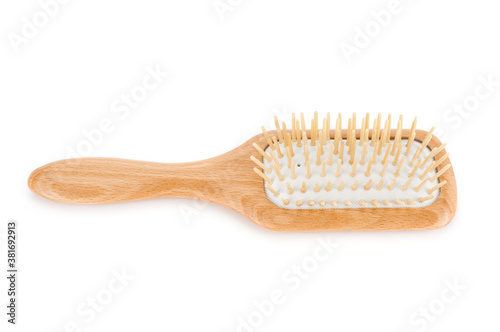 Wooden hair brush close up  on white background