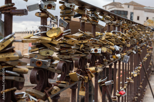 Railing full of padlocks on their irons by the tradition of the people to unite love and friendship in this way