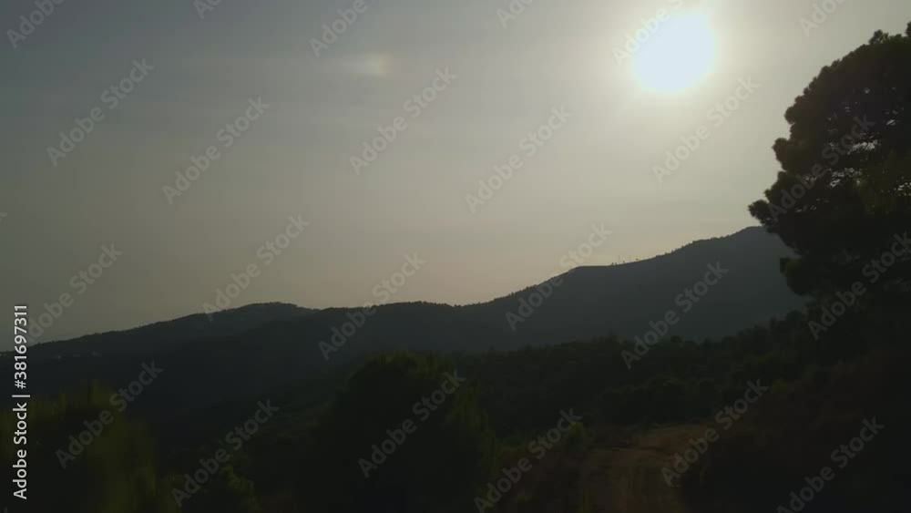 Aerial view of forest and mountains during sunset Aerial view of forest and mountains during sunset