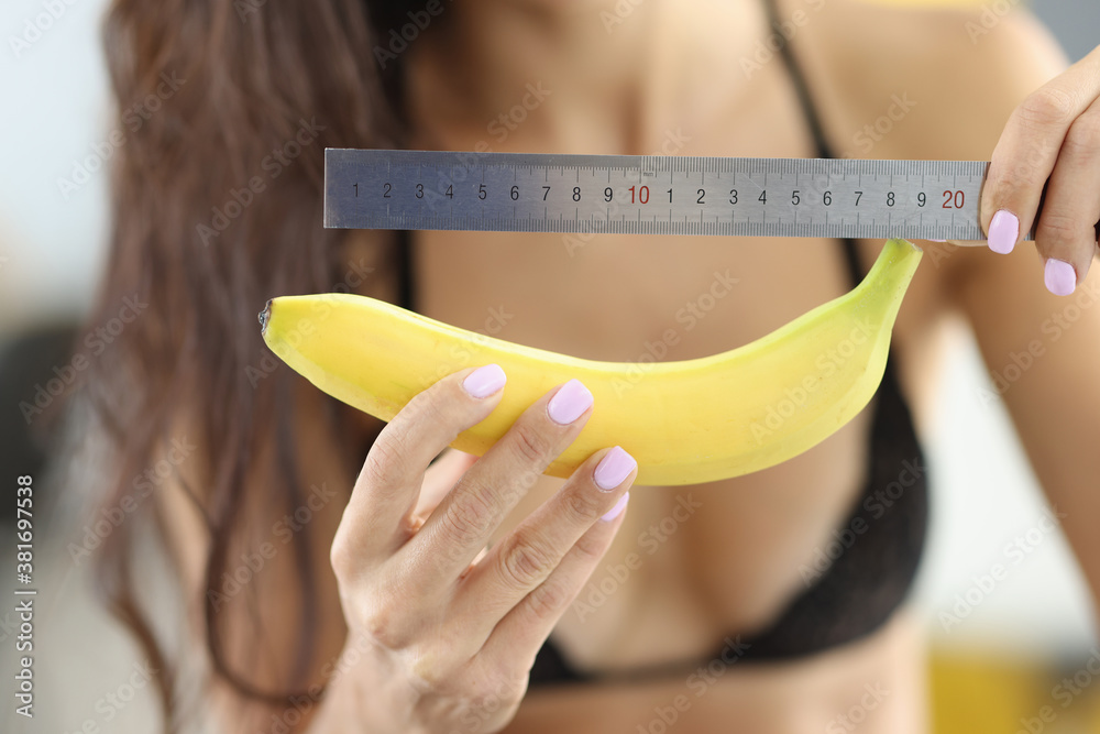 Woman in underwear holds banana and ruler. Average penis size concept Stock  Photo | Adobe Stock