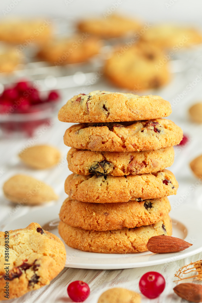 Freshly baked homemade Christmas cookies with cranberries, almonds and white chocolate. Delicious festive biscuit. Gingerbreads. Selective focus
