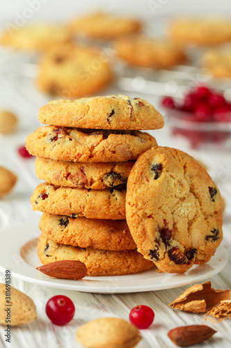 Freshly baked homemade Christmas cookies with cranberries, almonds and white chocolate. Delicious festive biscuit. Gingerbreads. Selective focus