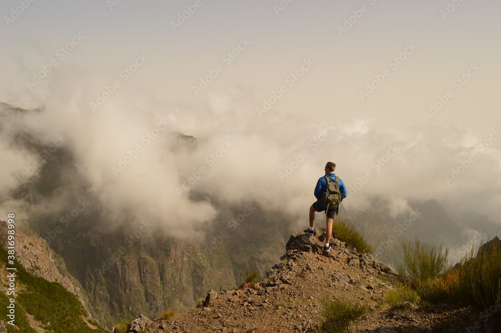 Hiking on the mountain ridge of Madeira Island on the way to Pico Ruivo, Portugal Hiking on the mountain ridge of Madeira Island on the way to Pico Ruivo, Portugal