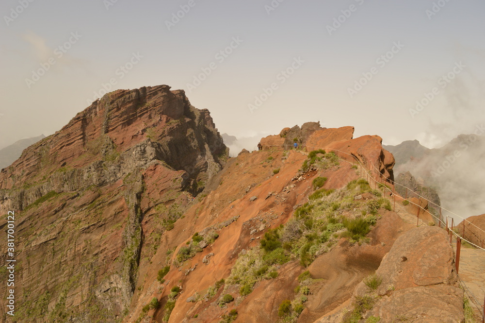 Hiking on the mountain ridge of Madeira Island on the way to Pico Ruivo, Portugal Hiking on the mountain ridge of Madeira Island on the way to Pico Ruivo, Portugal