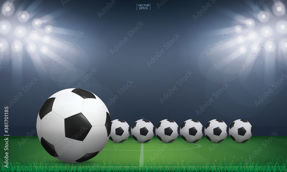 Naklejka premium Soccer football ball and green grass of soccer field stadium background. Vector.