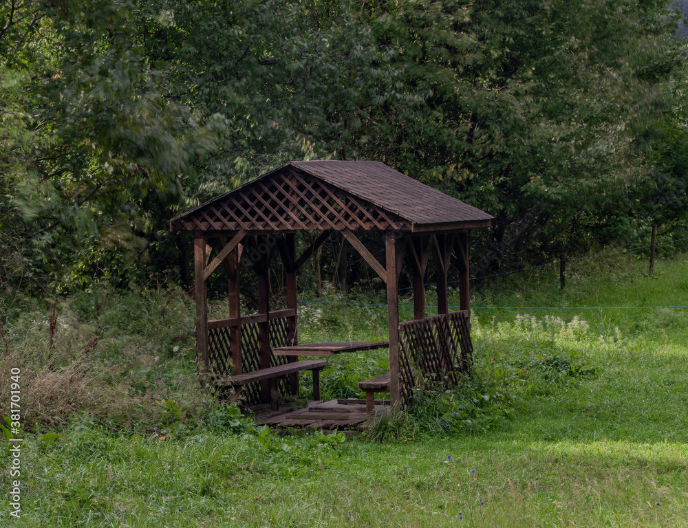 Wooden shelter on green pasture land near Osadne village Wooden shelter on green pasture land near Osadne village
