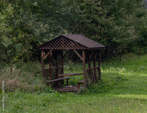 Wooden shelter on green pasture land near Osadne village