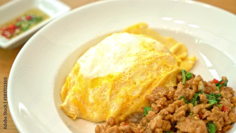stir-fried pork and basil with creamy omelet on rice - asian food style stir-fried pork and basil with creamy omelet on rice - asian food style
