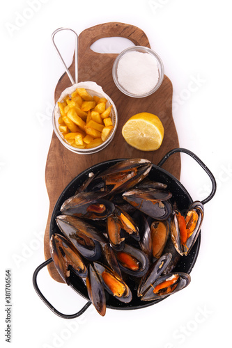 Moussels and french fries or molues-frites isolated on white background. Top view photo