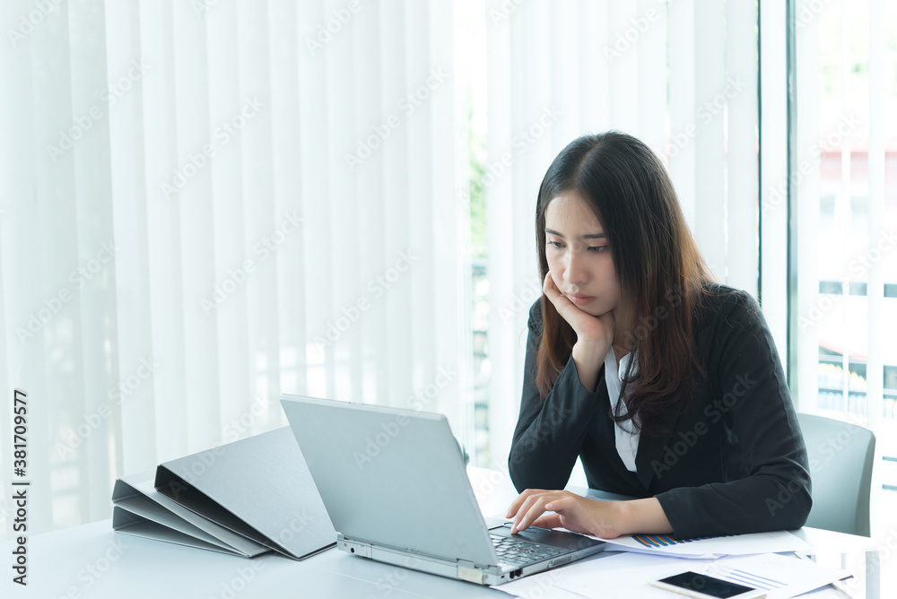Asian businesswoman stress from hard work,Thai worker woman working in the office,Dark tone Asian businesswoman stress from hard work,Thai worker woman working in the office,Dark tone