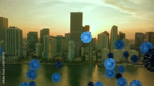 Coronavirus spreding in a city, - 3D motion graphics animation - Covid-19 particles on skyscraper buildings background photo