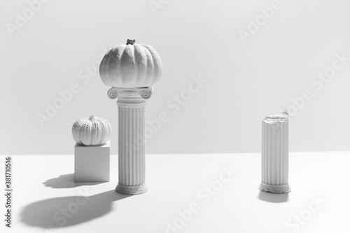 minimal concept with pumpkin and antique columns, for product presentation. Hollyday background