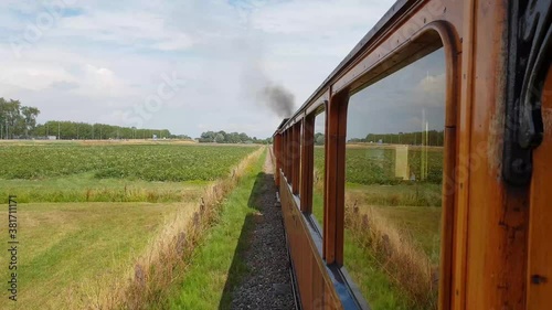 Old train travel trough the dutch landscape photo