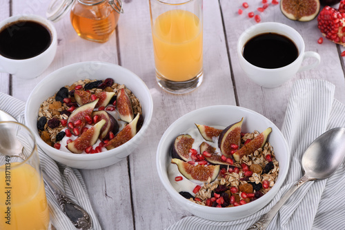 Breakfast. Muesli with oatmeal, figs and dried fruits photo