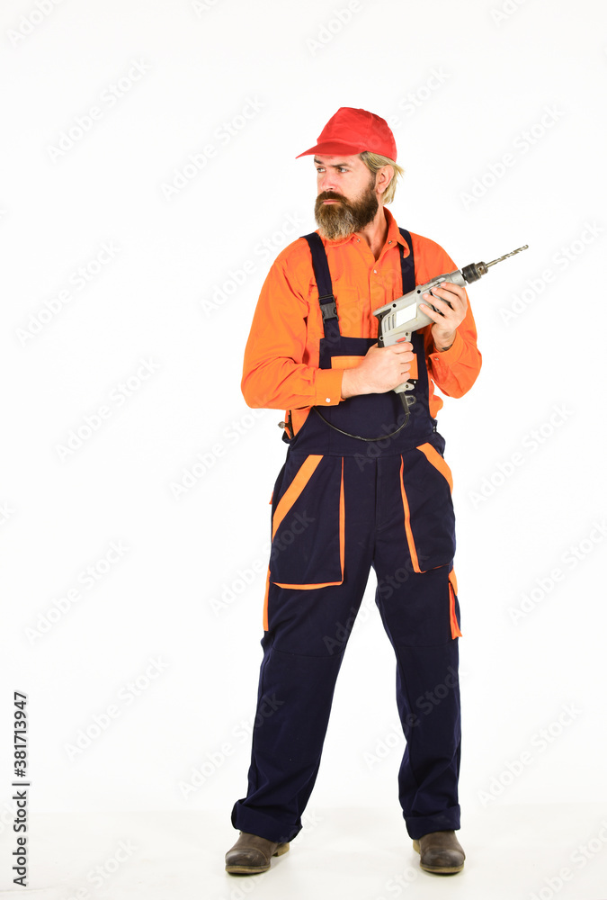 Safety measures. Man in cap with drills white background. Professional builder repairman makes hole. Drilling concept. Perforator and bit. Powerful drill. Buy drill. Toolbox tips drilling and fixing Safety measures. Man in cap with drills white background. Professional builder repairman makes hole. Drilling concept. Perforator and bit. Powerful drill. Buy drill. Toolbox tips drilling and fixing