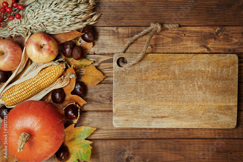 autumn background on wooden planks photo