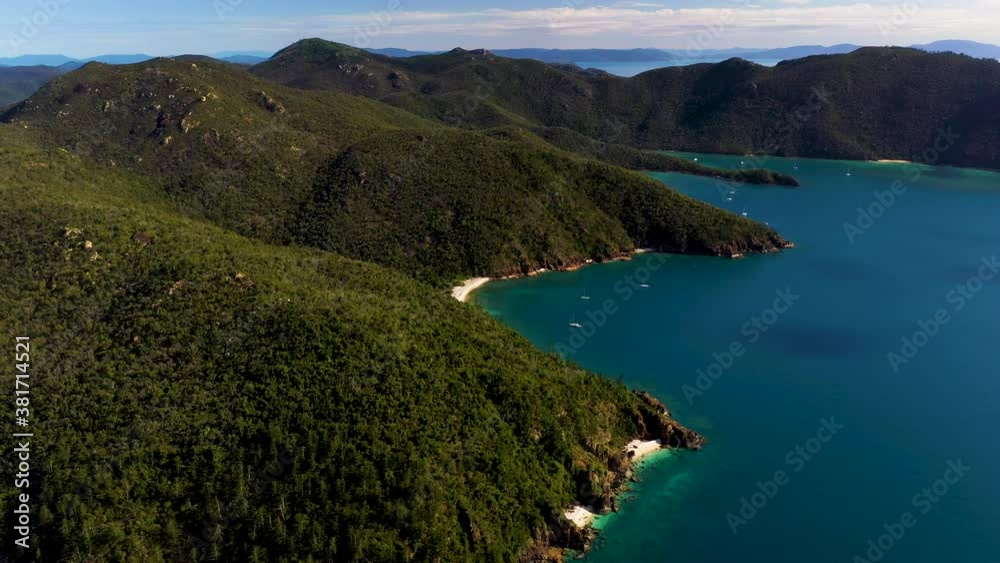 Wide drone shot of Hook Island with sailboats in the water. Near Whitsunday Island Australia Wide drone shot of Hook Island with sailboats in the water. Near Whitsunday Island Australia