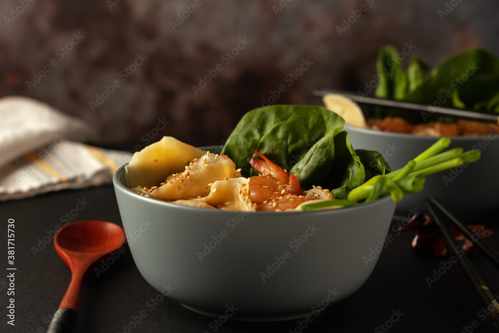 Shrimp noodle soup with wontons and spinach