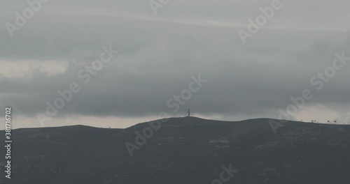 Motion Timelapse Of Clouds In The Dramatic Sky Above The Mountains In Serras De Aire And Candeeiros Natural Park In Portugal - wide shot photo