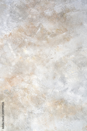 Grey concrete background with white and beige hues. Concept for your design.