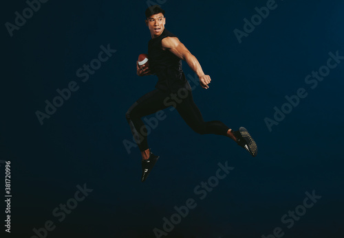 American football player running with ball