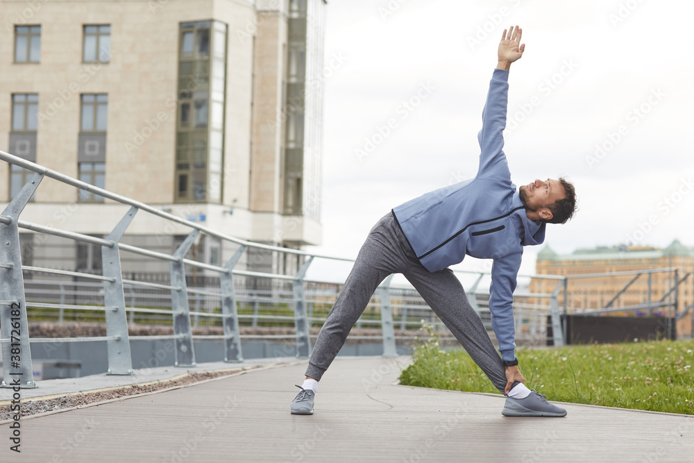 Young healthy man exercising outdoors during sports training